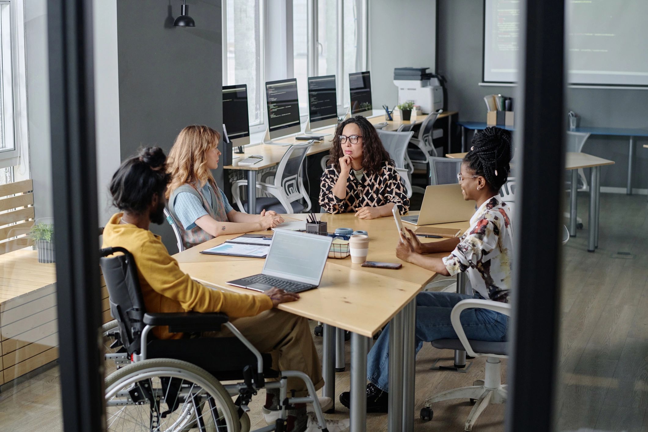 Team discussing funding and growth strategy in an office