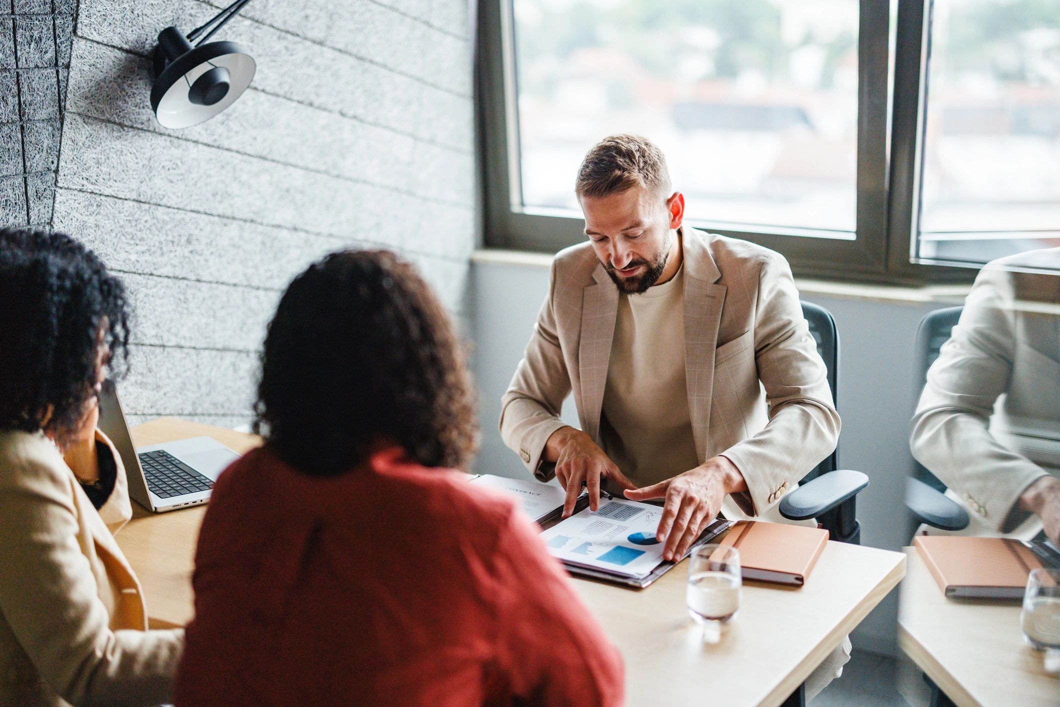 Advisors collaborating in a modern office